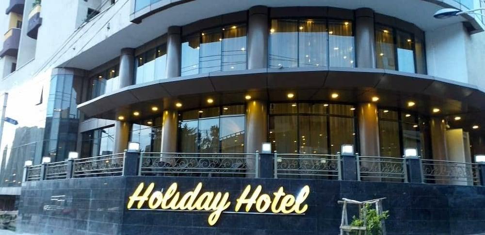 Holiday Hotel - Featured Image