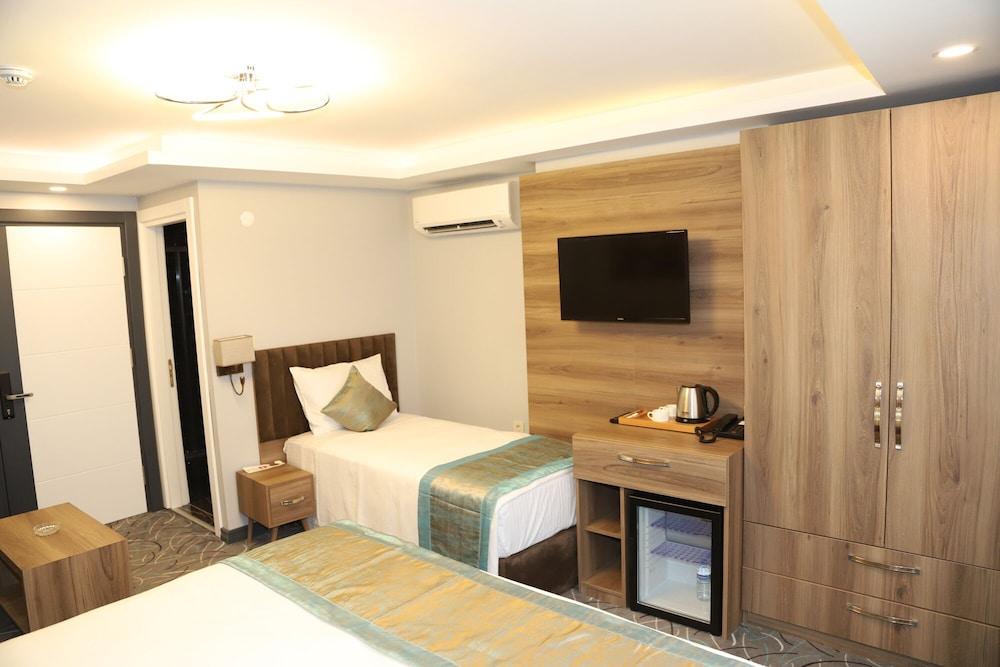 Grand Kavi Hotel - Room
